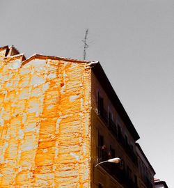 Low angle view of houses against clear sky