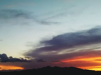 Scenic view of mountains at sunset