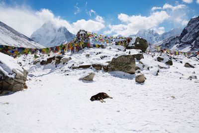 Scenic view of mountains against cloudy sky