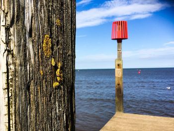 Pier on sea against clear sky