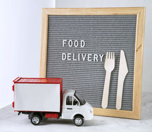 Information sign board on table against white background