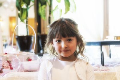 Portrait of girl with ice cream in restaurant