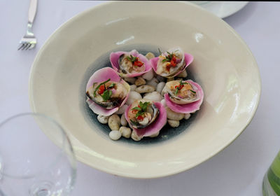 High angle view of pink flowers in bowl on table