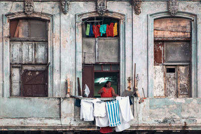 Rear view of woman in old building