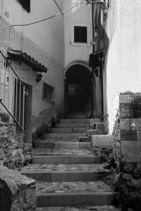 Alley amidst buildings in city