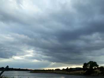 View of storm clouds over landscape