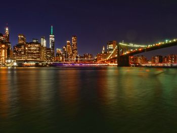 Illuminated city at waterfront