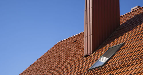 Low angle view of building against clear blue sky