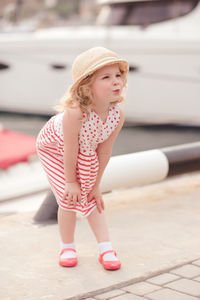 Cute girl puckering on jetty