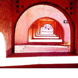 Narrow stairs leading to archway