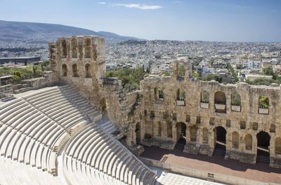 High angle view of old ruins in city against sky