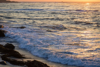 Scenic view of sea against sky at sunset