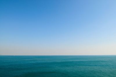 Scenic view of sea against clear blue sky