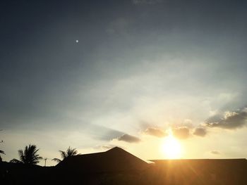 Low angle view of silhouette trees against sky during sunset