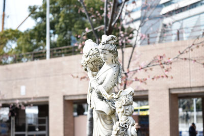 Statue of angel outside building