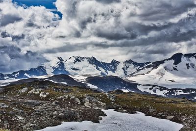 Scenic view of snowcapped mountains against sky