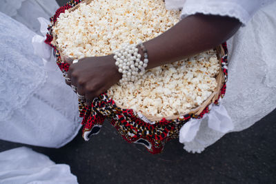 Midsection of woman holding bouquet