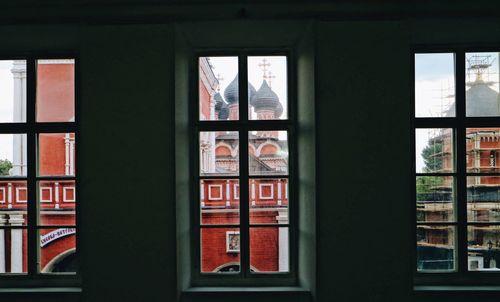 People standing by window in building