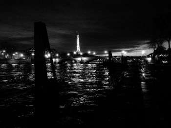 Illuminated city against sky at night