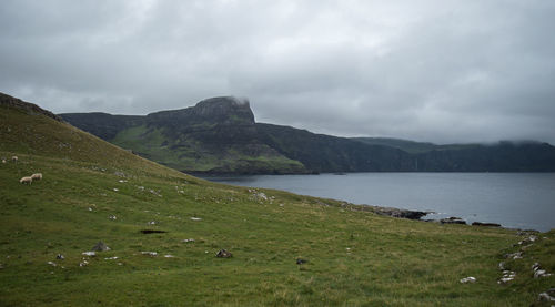 Scenic view of landscape and mountains against sky