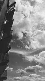 Low angle view of building against cloudy sky