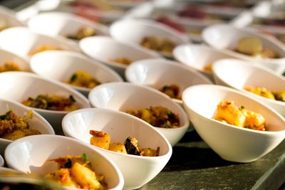 Close-up of food in bowls arranged on table