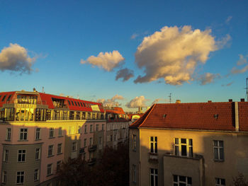 Residential buildings against blue sky