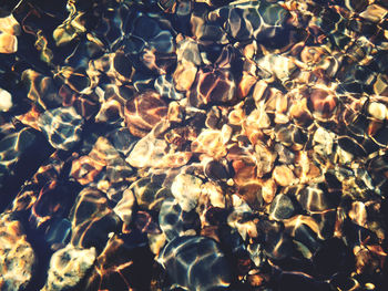Full frame shot of stones in sea