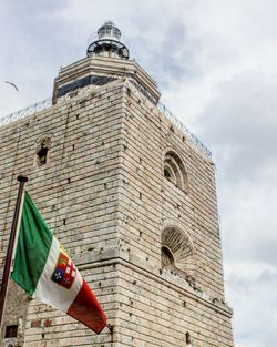 Low angle view of bell tower against sky