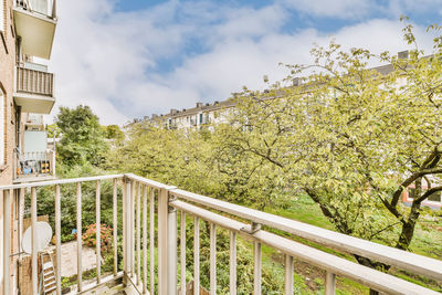 Low angle view of woman standing on railing