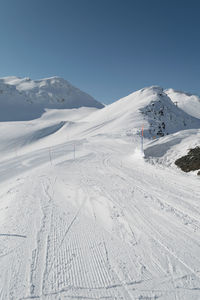 Snowcapped mountain against clear sky