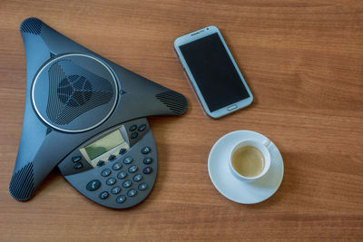 High angle view of smart phone on table