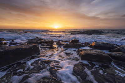 Scenic view of sea against sky during sunset