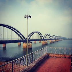 Bridge over river against sky