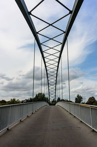 Bridge over road against sky