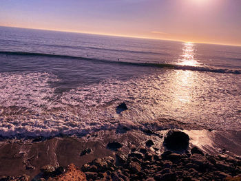 Scenic view of sea against sky during sunset