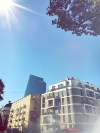 Low angle view of buildings against blue sky