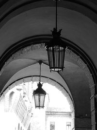 Low angle view of illuminated chandelier hanging in building