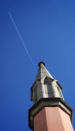 Low angle view of building against clear blue sky