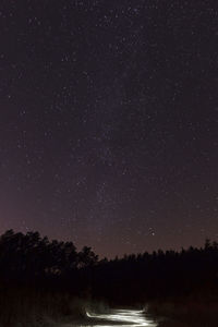 Scenic view of lake against star field at night