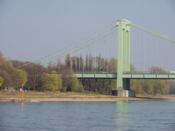 Bridge over river against clear sky