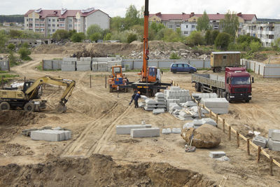 High angle view of construction site by buildings