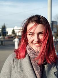 Portrait of beautiful young woman outdoors