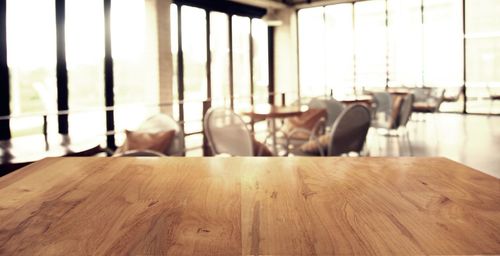 Empty chairs and tables in restaurant