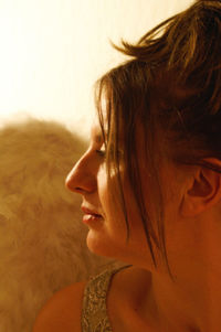 Close-up of young woman looking away