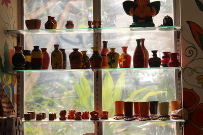 Multi colored bottles in glass container