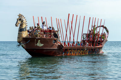 View of ship in sea against sky