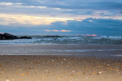 Scenic view of beach against sky during sunset