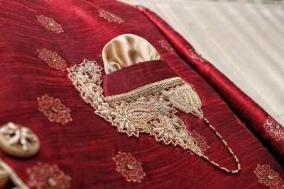 High angle view of mannequin on red fabric