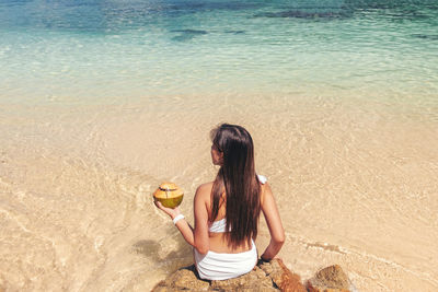 Woman sitting on beach